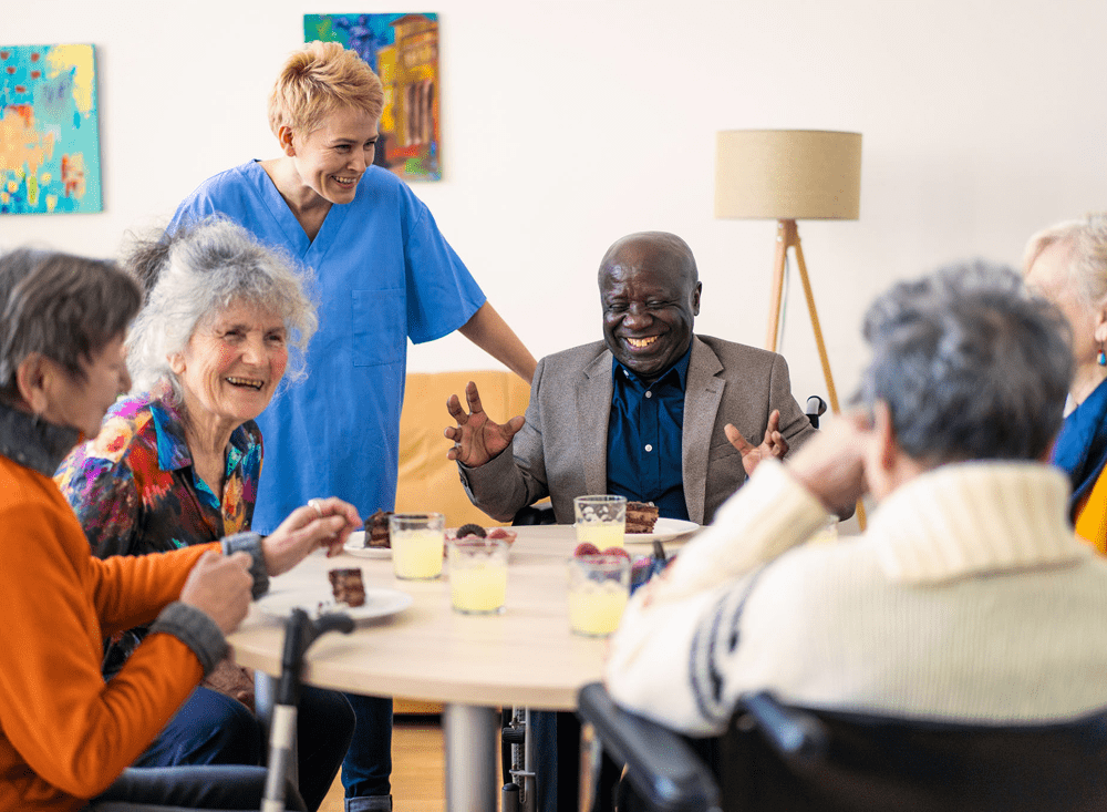 Elderly group enjoying time with caregiver.
